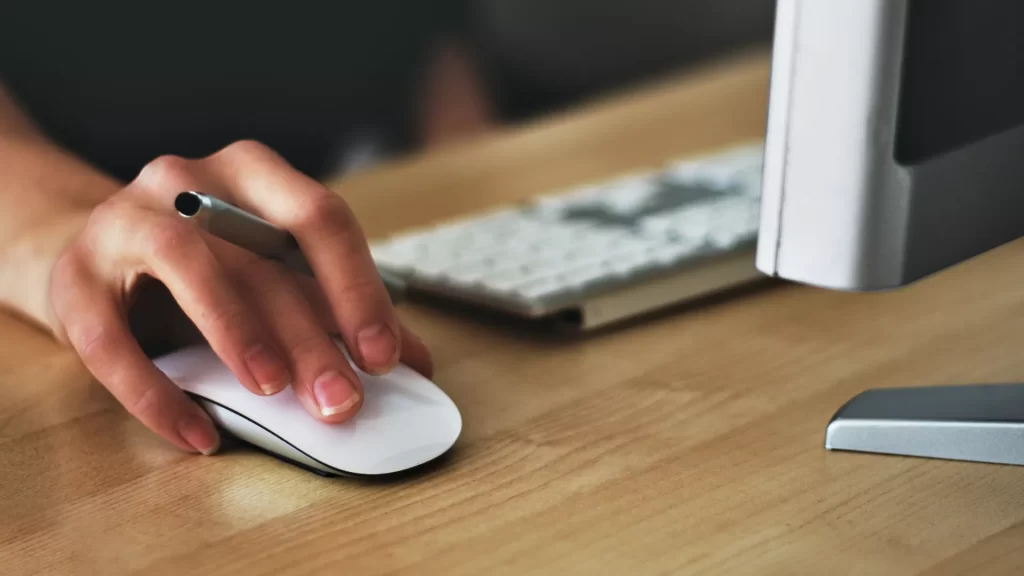 woman using computer mouse