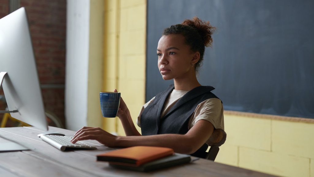 woman at computer with coffee