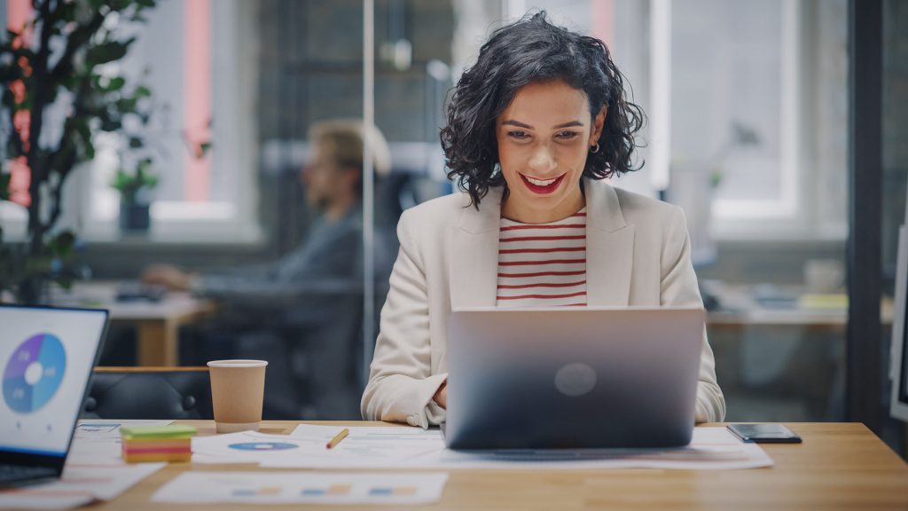 woman using laptop at table